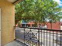 City view from a condo balcony with a geometric iron railing and textured stucco wall at 1910 E Palm Ave # 11216, Tampa, FL 33605
