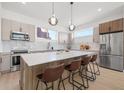 Bright kitchen boasts stainless steel appliances, pendant lighting, and a large island with seating at 2112 4Th S St, St Petersburg, FL 33705