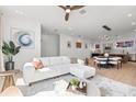 Open-concept living area with modern furnishings and seamless transition to dining and kitchen spaces at 2112 4Th S St, St Petersburg, FL 33705