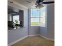 Cozy dining area adjacent to the kitchen with scenic views, featuring a ceiling fan and a bright, airy atmosphere at 2333 Feather Sound Dr # B511, Clearwater, FL 33762