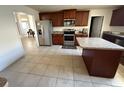 Spacious kitchen with stainless steel appliances, granite counters, and island at 26357 Trinilas Dr, Punta Gorda, FL 33983