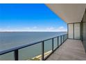 Spacious balcony with glass railings overlooking the beautiful waterfront view at 2912 W Santiago St # 1401, Tampa, FL 33629