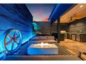 This stunning rooftop deck has a built-in fire pit, outdoor kitchen, grill, and custom mood lighting at 325 2Nd N St, St Petersburg, FL 33701