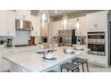 Modern kitchen featuring a center island, stainless steel appliances, and pendant lighting at 3408 Lumber Falls Dr, Plant City, FL 33565
