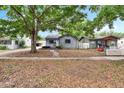 Cozy one-story home with mature trees, providing a serene and welcoming atmosphere in a residential area at 4102 Haines N Rd, St Petersburg, FL 33703