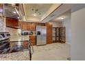 The kitchen features granite countertops and stainless steel appliances at 4722 Millpond Ln, Tampa, FL 33624