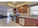 Kitchen boasts granite countertops and stainless steel appliances at 4722 Millpond Ln, Tampa, FL 33624