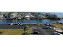 Well-maintained parking area with ample spaces near waterfront residences and scenic canal at 5915 Sea Ranch Dr # 512, Hudson, FL 34667