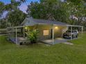 Detached garage offers additional storage space and covered parking at 7508 W Short Rd, Plant City, FL 33565
