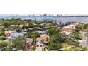Breathtaking aerial view of waterfront homes and city skyline on the bay at 90 Bahama Cir, Tampa, FL 33606