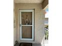 Inviting front door with a welcome mat and decorative wreath creating a warm entrance to the home at 10032 65Th N Ave # 14, St Petersburg, FL 33708