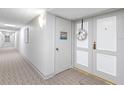 Hallway entrance decorated with a wreath with elevator acess at 1460 Gulf Blvd # 509, Clearwater Beach, FL 33767