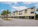 Inviting townhome complex with well-manicured grounds and assigned parking at 1500 Sunset Rd # F8, Tarpon Springs, FL 34689