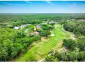 Spacious lot on a golf course with mature trees surrounding this lovely single-Gathering home at 2220 Muirfield Way, Oldsmar, FL 34677