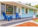 Inviting front porch with seating, offering a cozy spot to relax and enjoy the neighborhood ambiance at 2616 Fairway S Ave, St Petersburg, FL 33712