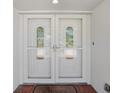 Elegant double front doors with decorative glass panels welcome you inside this home at 2673 Clubhouse S Dr, Clearwater, FL 33761