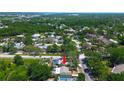 Aerial image displaying the home with a pool, showcasing its location within the neighborhood at 3647 Lake St George Dr, Palm Harbor, FL 34684
