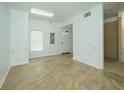 Bright entryway with tiled floors, white walls, a front door, and access to other rooms at 6507 Spring Oak Ct, Tampa, FL 33625