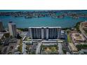 Stunning aerial view of a modern high-rise building, with coastal views and covered parking at 7050 Sunset S Dr # 912, South Pasadena, FL 33707