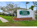 Seminole Garden Apartments sign with brick planter and neatly manicured lawn at 8533 110Th St # 207, Seminole, FL 33772