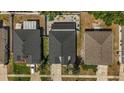 Aerial view of home showcasing backyard patio area with outdoor seating, a pool, and neatly manicured landscaping at 13215 Beechberry Dr, Riverview, FL 33579