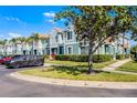 Well-maintained townhome exterior with landscaped grounds, car park, and mature trees at 1601 Fluorshire Dr, Brandon, FL 33511