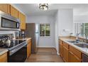 Functional kitchen featuring stainless steel appliances, wood cabinets, and lots of counter space at 1601 Fluorshire Dr, Brandon, FL 33511