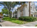 Condo exterior showing well-maintained landscape, sidewalks, and multiple units at 3261 Haviland Ct # 303, Palm Harbor, FL 34684
