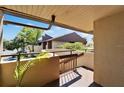 This condo features a cozy balcony with views of surrounding trees and a glimpse of other units at 880 S Village N Dr # 202, St Petersburg, FL 33716