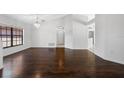 Bright living room features wood floors, and big windows at 1061 Archway Dr, Spring Hill, FL 34608