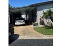 Cozy home with convenient covered parking and tidy landscaping at 12501 Ulmerton Rd # 216, Largo, FL 33774