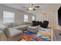 Spacious living room with a sectional sofa, area rug, and wood flooring at 1411 Gray S St, Gulfport, FL 33707