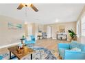Open living space with stylish furnishings, wood-look floors, and neutral color palette at 602 Stephens Rd, Ruskin, FL 33570