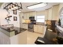 Beautiful kitchen with granite countertops, tiled backsplash, and modern stainless steel appliances at 6060 Shore S Blvd # 200, Gulfport, FL 33707
