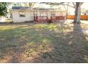 Spacious backyard featuring a wood deck, perfect for outdoor enjoyment and entertaining at 125 80Th N Ave, St Petersburg, FL 33702