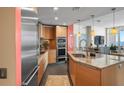 Bright modern kitchen featuring stainless steel appliances, granite countertops and a breakfast bar with ocean views at 175 1St S St # 2005, St Petersburg, FL 33701