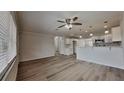 Bright, open living space with hardwood flooring, a ceiling fan, and recessed lighting at 1835 Nevada Ne Ave, St Petersburg, FL 33703