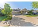 Inviting single-Gathering home boasting well-maintained landscaping, a two-car garage, and a welcoming entrance at 20146 Heritage Point Dr, Tampa, FL 33647