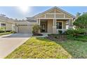 Charming single-Gathering home with manicured lawn and attached two-car garage, offering great curb appeal at 20146 Heritage Point Dr, Tampa, FL 33647