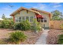 Lovely home with well-kept landscaping, an awning, and a stone walkway at 3120 8Th N Ave, St Petersburg, FL 33713