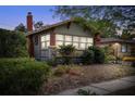 Charming home featuring a brick chimney, ample windows, and tasteful landscaping at 3120 8Th N Ave, St Petersburg, FL 33713