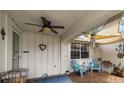Comfortable outdoor seating area with chairs, table, and overhead shade creating a relaxing space at 4209 Stratfield Dr, New Port Richey, FL 34652