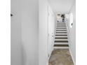 Bright entryway with staircase leading to upper levels and tile flooring at 472 Sandy Hook Rd, Treasure Island, FL 33706