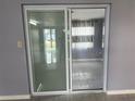 Sliding glass door leading to the outside, providing natural light at 5151 Janice Ln, Holiday, FL 34690