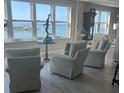 Living room features water view with comfortable seating and unique decor at 5200 Brittany S Dr # 1502, St Petersburg, FL 33715