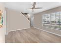 Empty living room with wood-look flooring and a ceiling fan at 5503 67Th N Ave # 18, Pinellas Park, FL 33781
