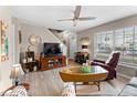 Relaxing living room featuring wood-look flooring, a ceiling fan, and neutral paint at 5503 67Th N Ave # 18, Pinellas Park, FL 33781