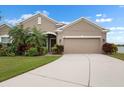 Inviting one-story home with a well-kept lawn, tropical landscaping, and a convenient two-car garage at 626 15Th Nw Ave, Ruskin, FL 33570