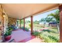 Inviting covered front porch with stone accents and comfortable outdoor seating at 630 48Th N Ave, St Petersburg, FL 33703