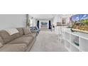 Bright living room with neutral decor, carpet floors and lots of natural light at 630 48Th N Ave, St Petersburg, FL 33703